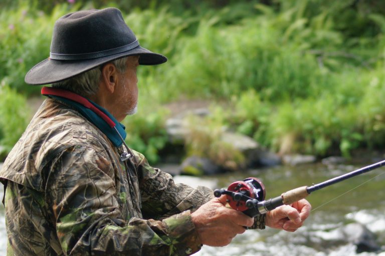 Man Fishing at a River