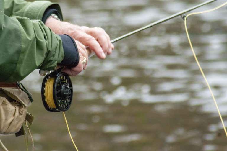 Man Holding a Fly Rod