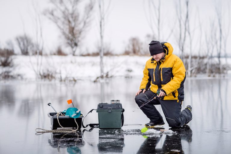 Man Fishing on Frozen Lake