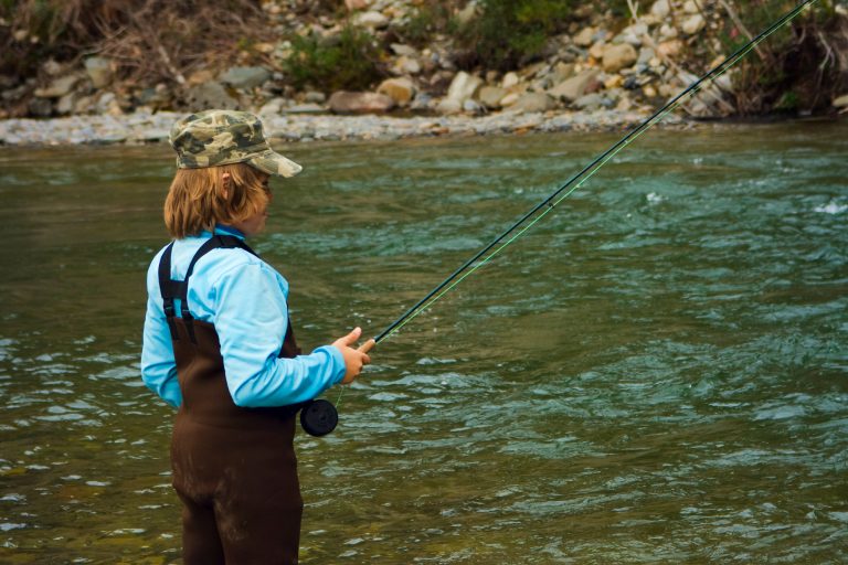 Child Fishing on a River