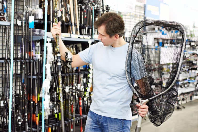 Man Browsing at a Fishing Store