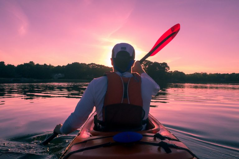 Man Sitting In the Front Part of a Kayak