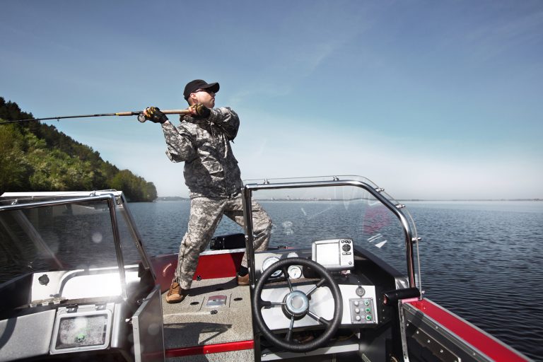 Man Casting a Rod While on a Boat