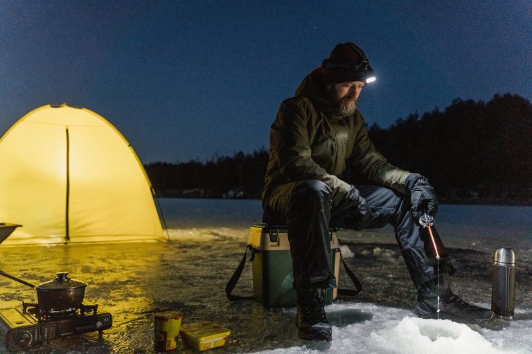 Man Fishing Using a Headlight