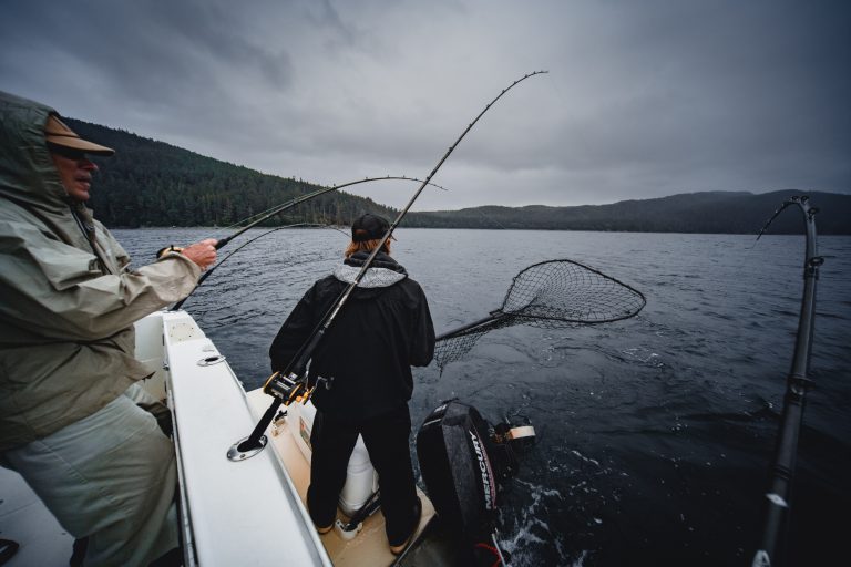Man Preparing To Catch A Fish with a Net