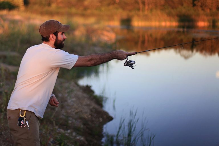 Man Fishing at a Lake