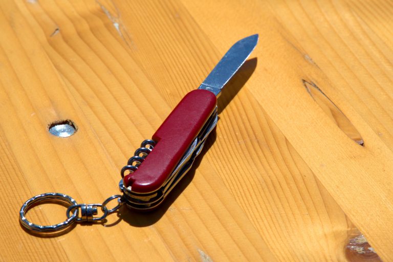 Multi Tool Knife on Wooden Surface
